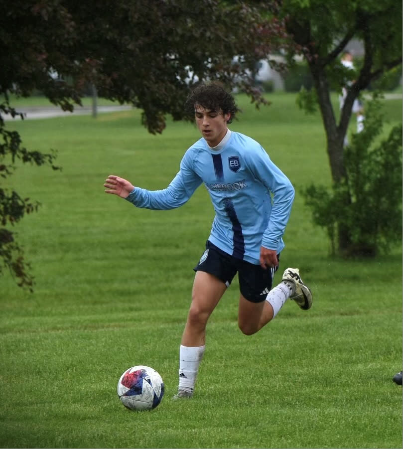 Jacob Clark on the soccer field at golden hour